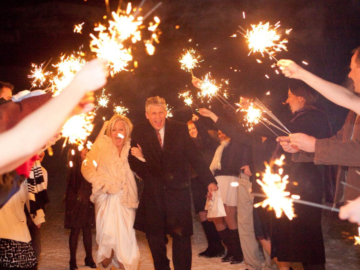 a group of people standing around a fire