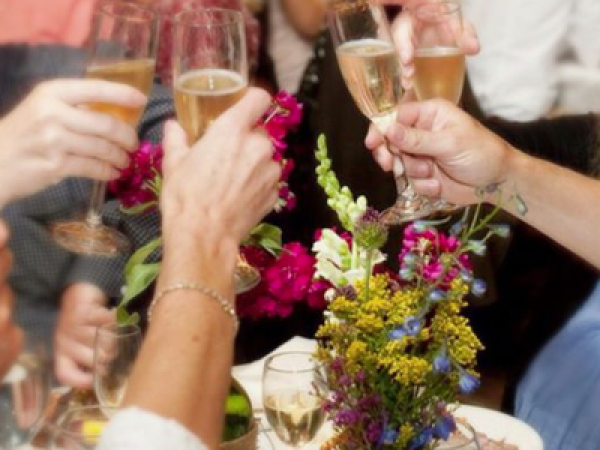 a person holding a wine glass