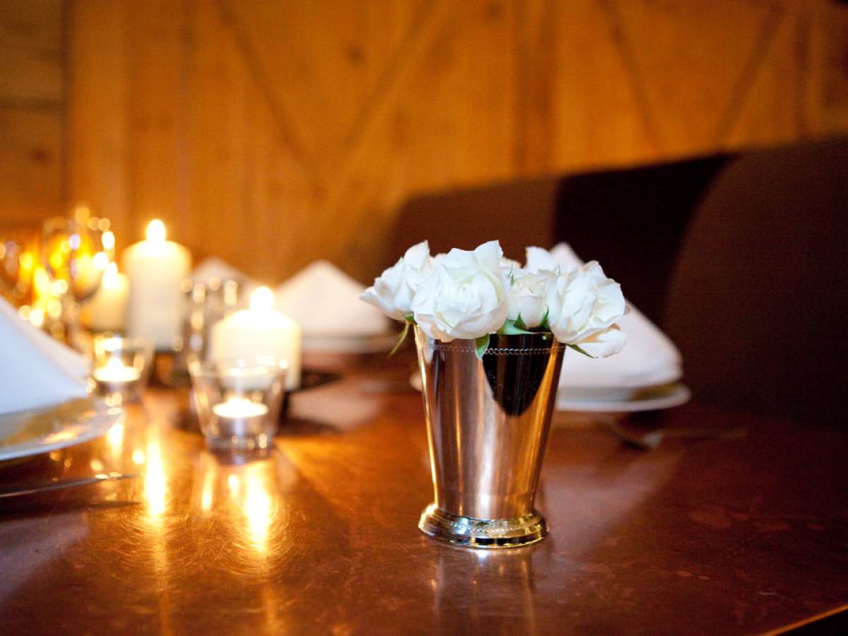 a vase sitting on top of a wooden table