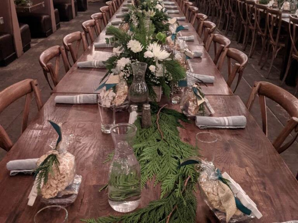 a room filled with furniture and vase of flowers on a table