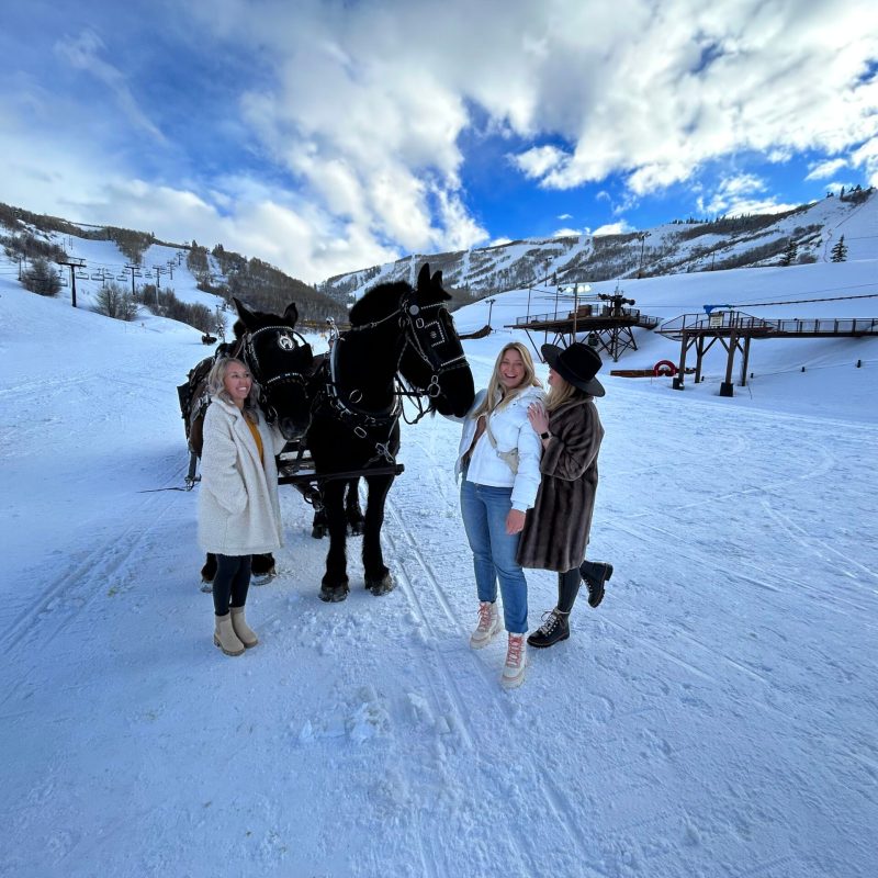 Three women before going on sleigh ride in Park City, Utah.